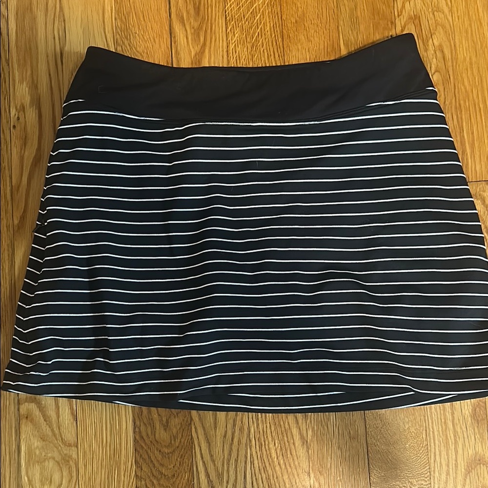 Black and White Striped Women's Skort. Right side zippered pocket.